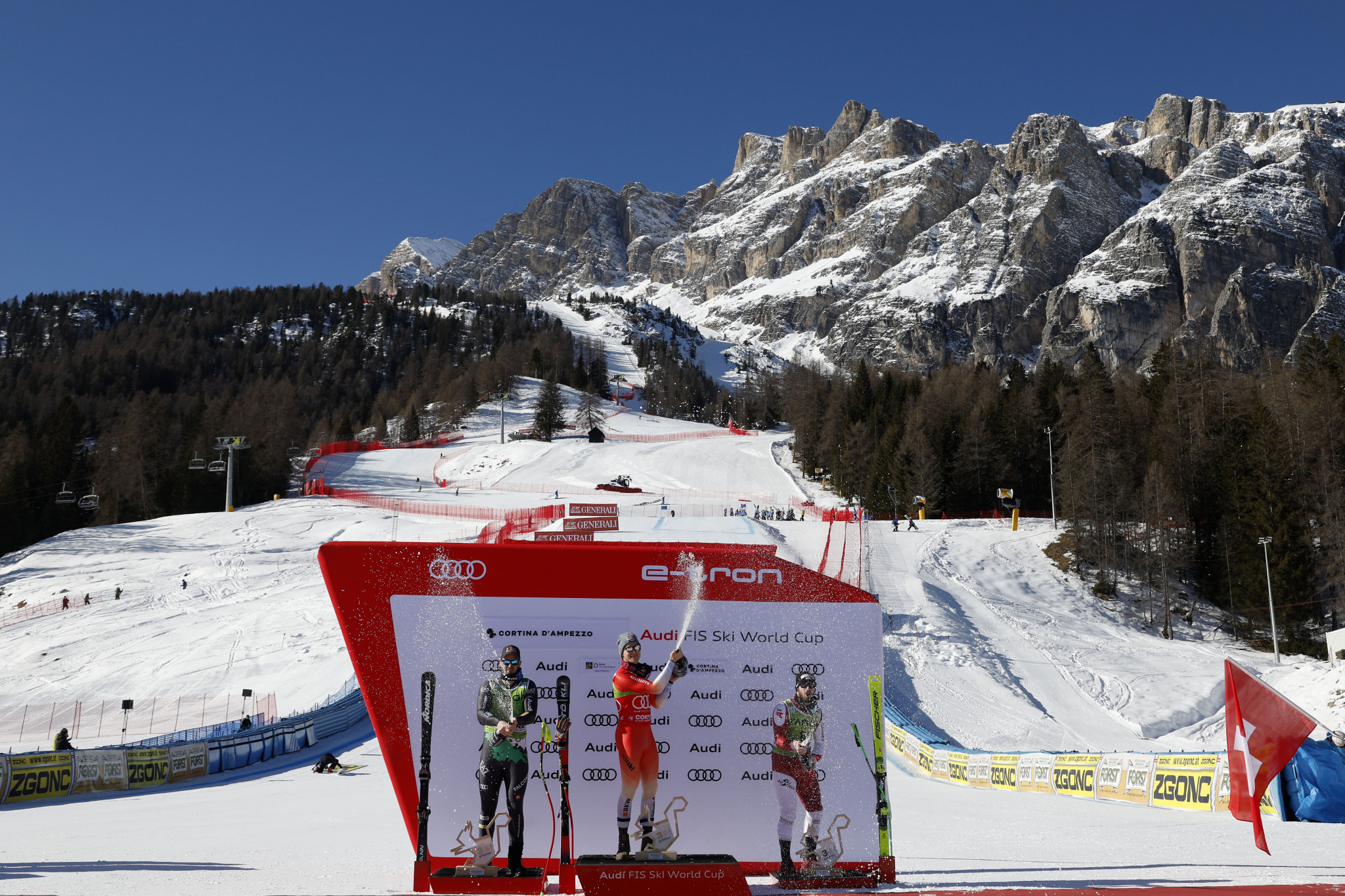 The podium for the FIS Alpine Skiing World Cup in Cortina D'Ampezzo, with Marco Odermatt centre winning a second successive super-G title in as many days ©Getty Images