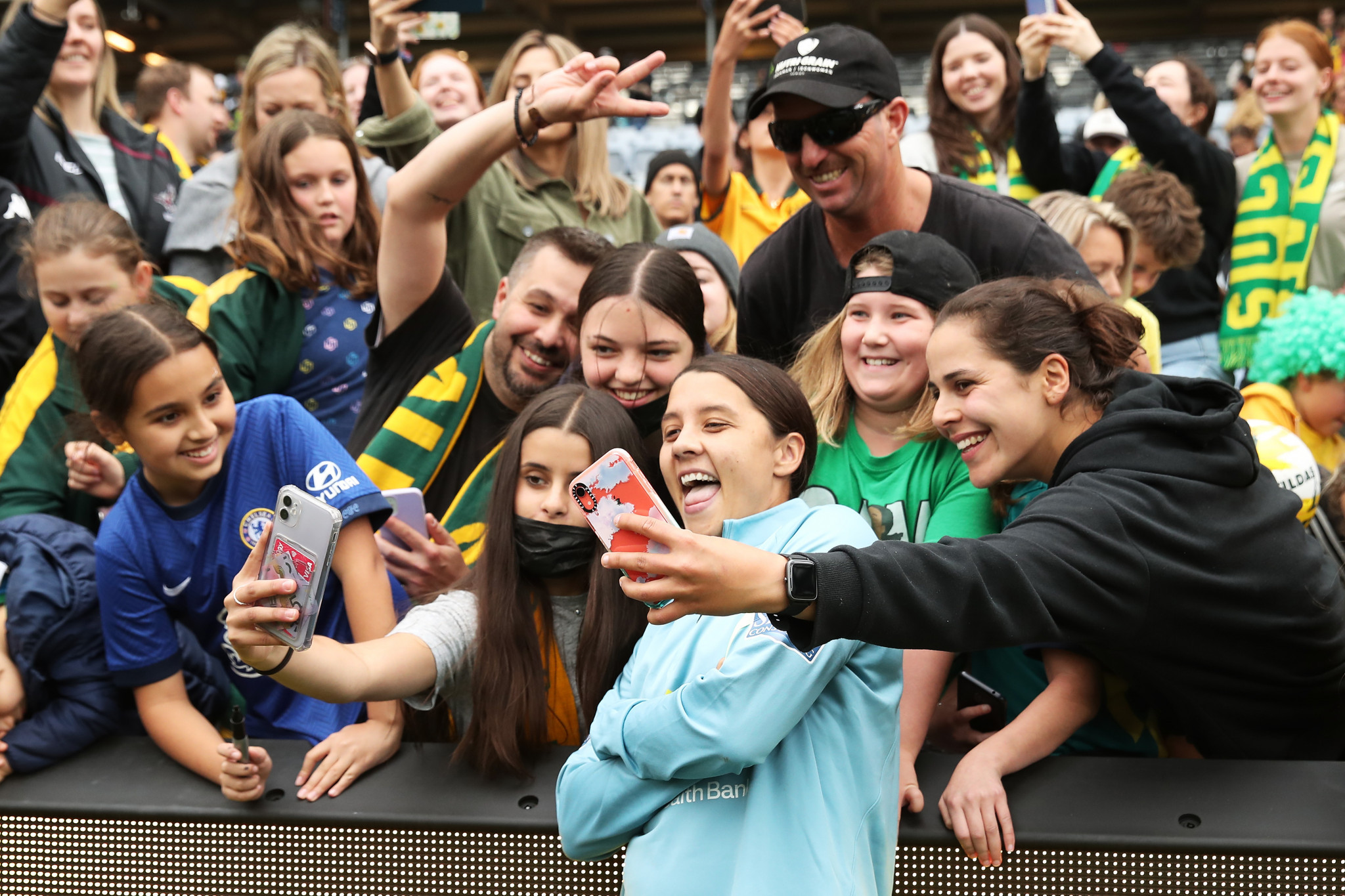 Australia's Sam Kerr, with part of the record 36,109 crowd for the women's international between Australia and the United States, at Stadium Australia in November 2021 ©Getty Images