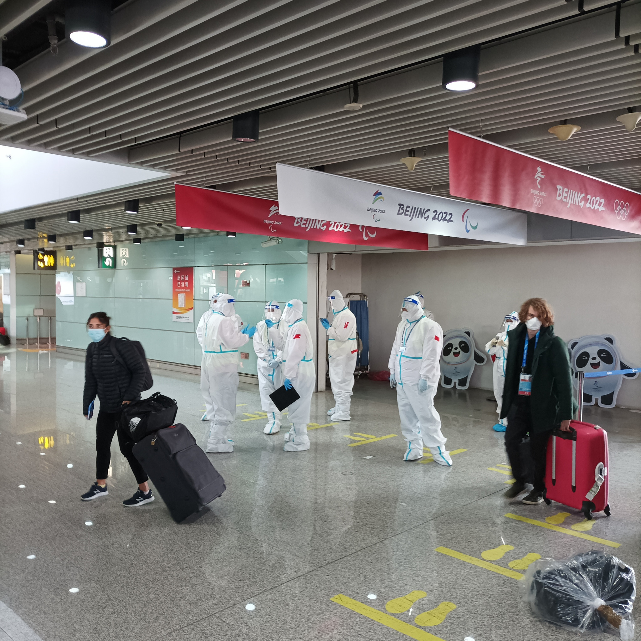 Welcome to Beijing, airport staff wore Hazmat suits as they welcomed visitors arriving for the 2022 Winter Olympic Games ©ITG