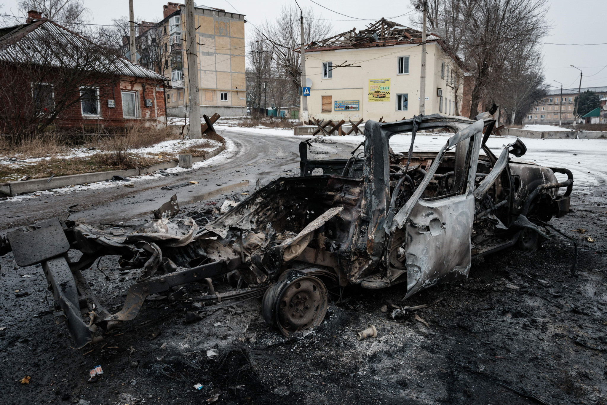 A car is destroyed following shellings in Bakhmut, where there is intense fighting and two young Ukrainian athletes have been killed in action recently ©Getty Images