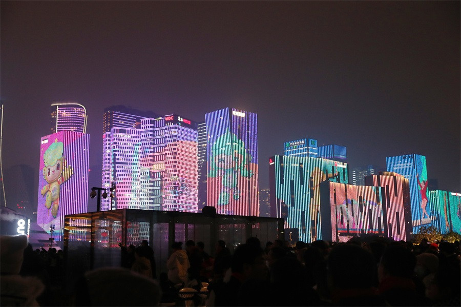 Buildings were lit up with images of the Hangzhou 2022 mascots ©Hangzhou 2022