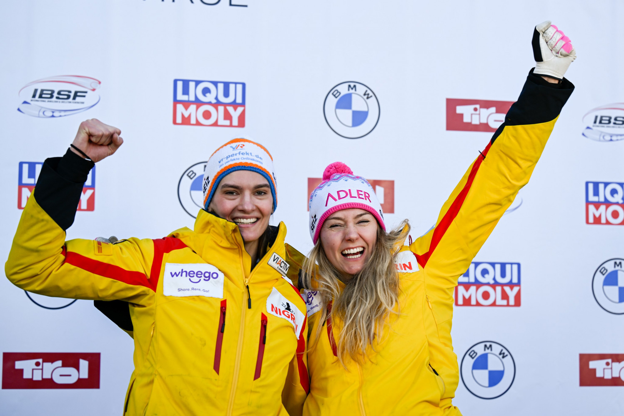 Laura Nolte, left, celebrates with push athlete Neele Schuten following their victory in Innsbruck ©IBSF