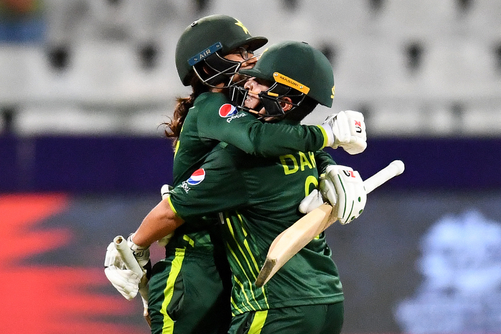 Muneeba Ali, left, celebrates with Nida Dar after scoring a century during Pakistan's win over Ireland ©Getty Images  
