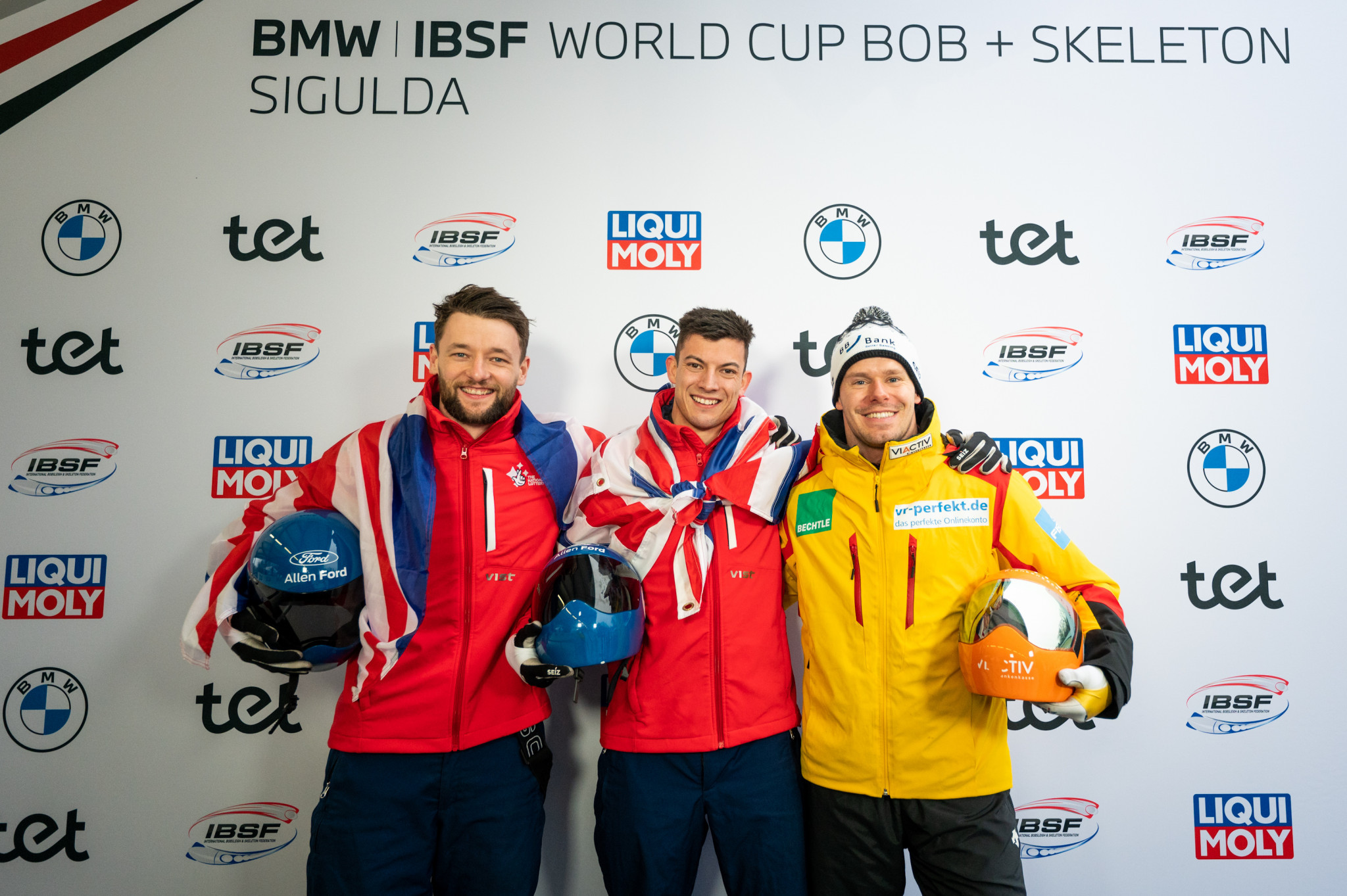 Britain's Matt Weston, centre, won his fourth consecutive World Cup race in Sigulda, but Germany's Christopher Grotheer, right, claimed the Crystal Globe ©IBSF