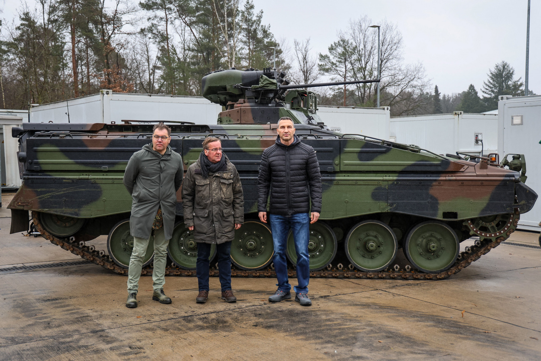 Ukrainian boxing great Wladimir Klitschko, left, with German Defence Minister Boris Pistorius, centre, and Germany's Ambassador for Ukraine Oleksii Makeiev at the Armoured Corps Training Centre in Münster ©Getty Images
