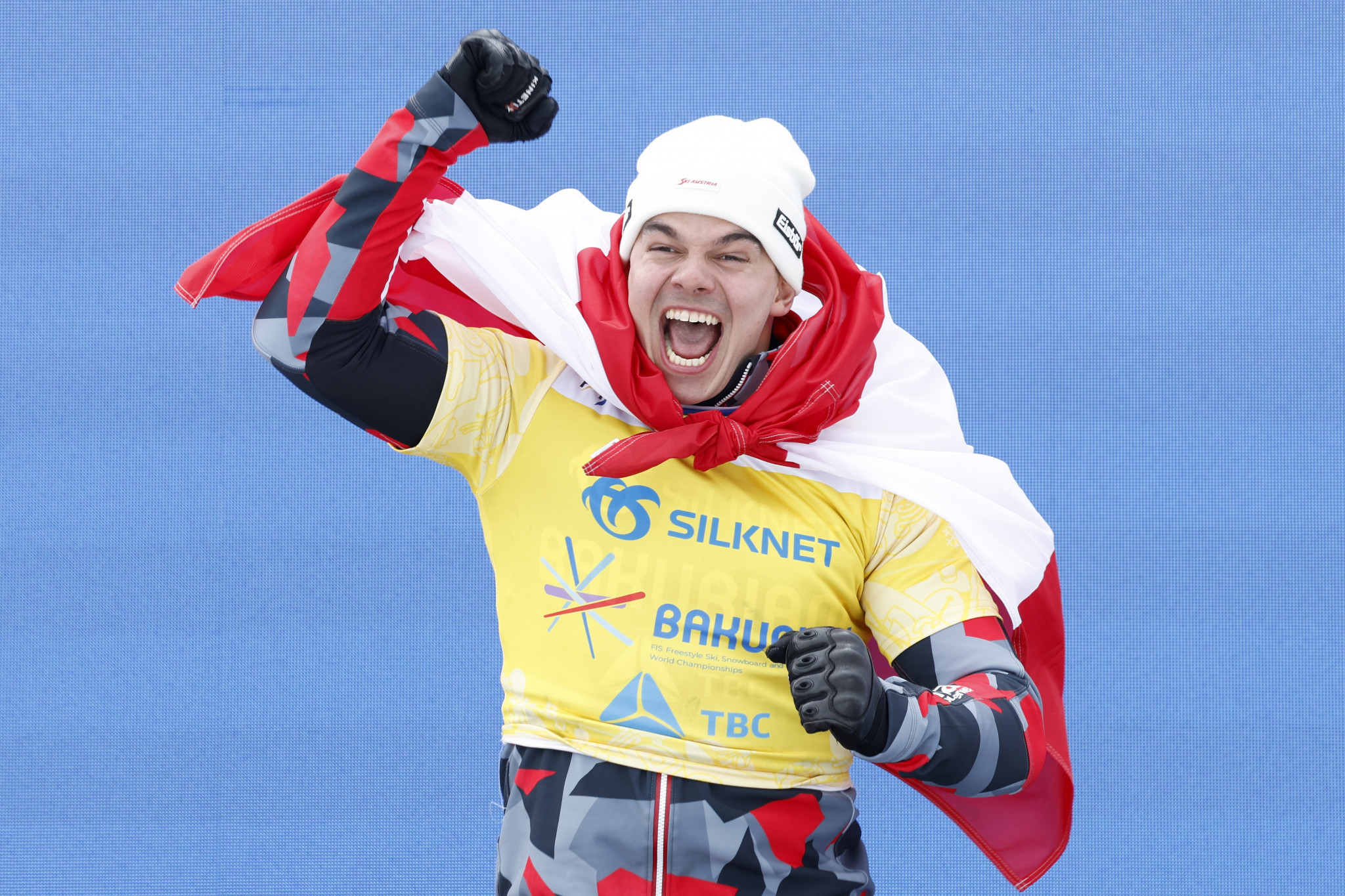 Austria's Jakob Dusek celebrates after winning a dramatic men's snowboard cross final ©Getty Images