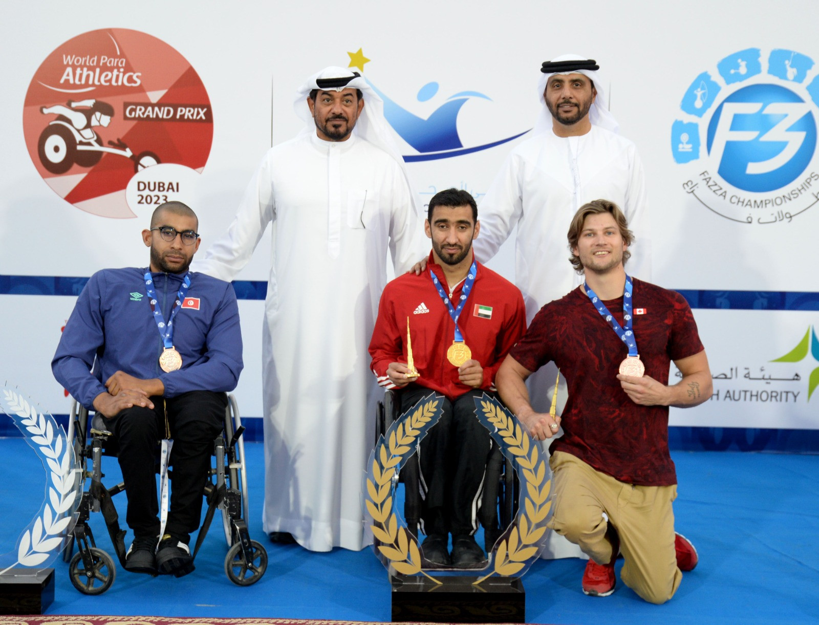 Mohammed Alhammadi, centre, set the Asian record for the men's 400m T34 at the Dubai 2023 World Para Athletics Grand Prix ©DCD