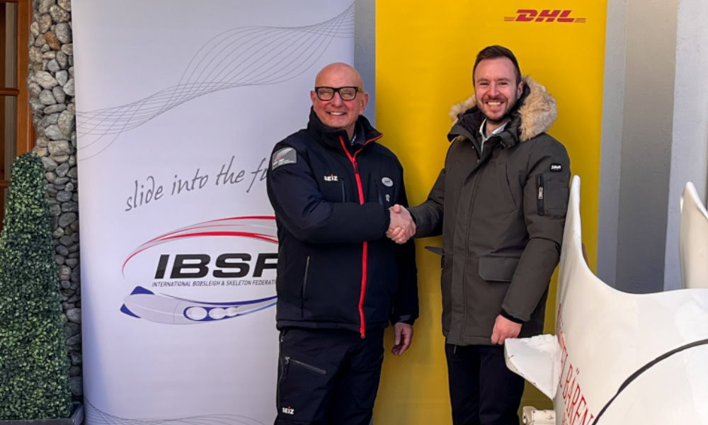 Ivo Ferriani, left, finalised the deal with DHL Global Event Logistics at a signing in St. Moritz ©IBSF