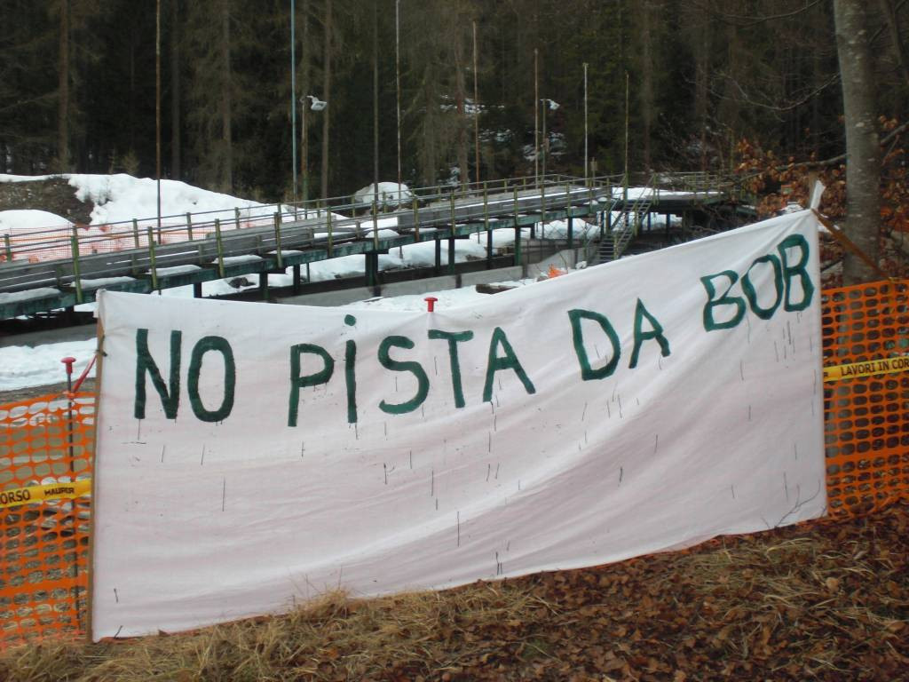 A banner protesting against the new sliding centre was placed at the demolition site ©Twitter