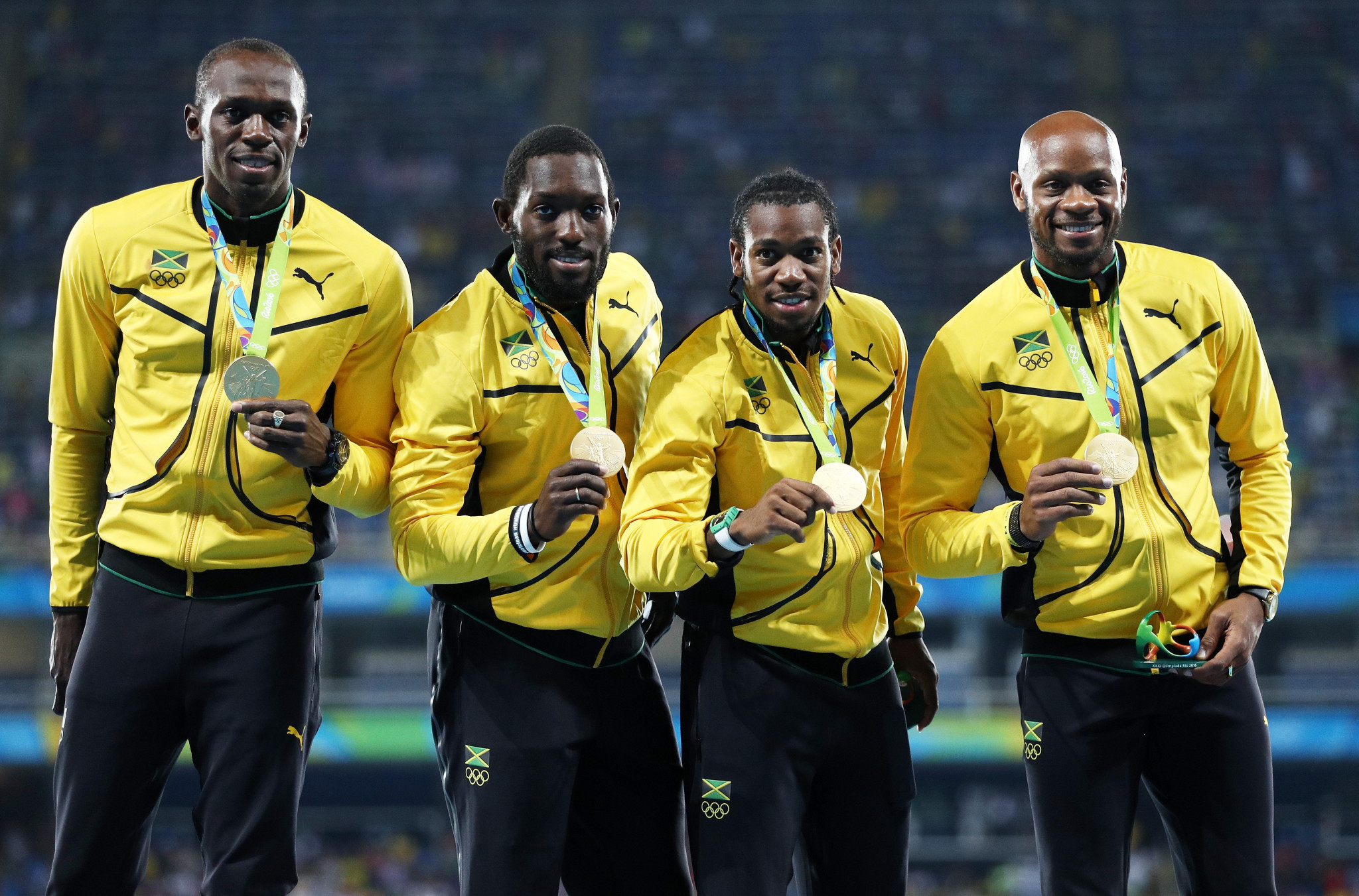 Asafa Powell, right, was part of Jamaica's gold medal-winning men's 4x100m relay team at Rio 2016 ©Getty Images
