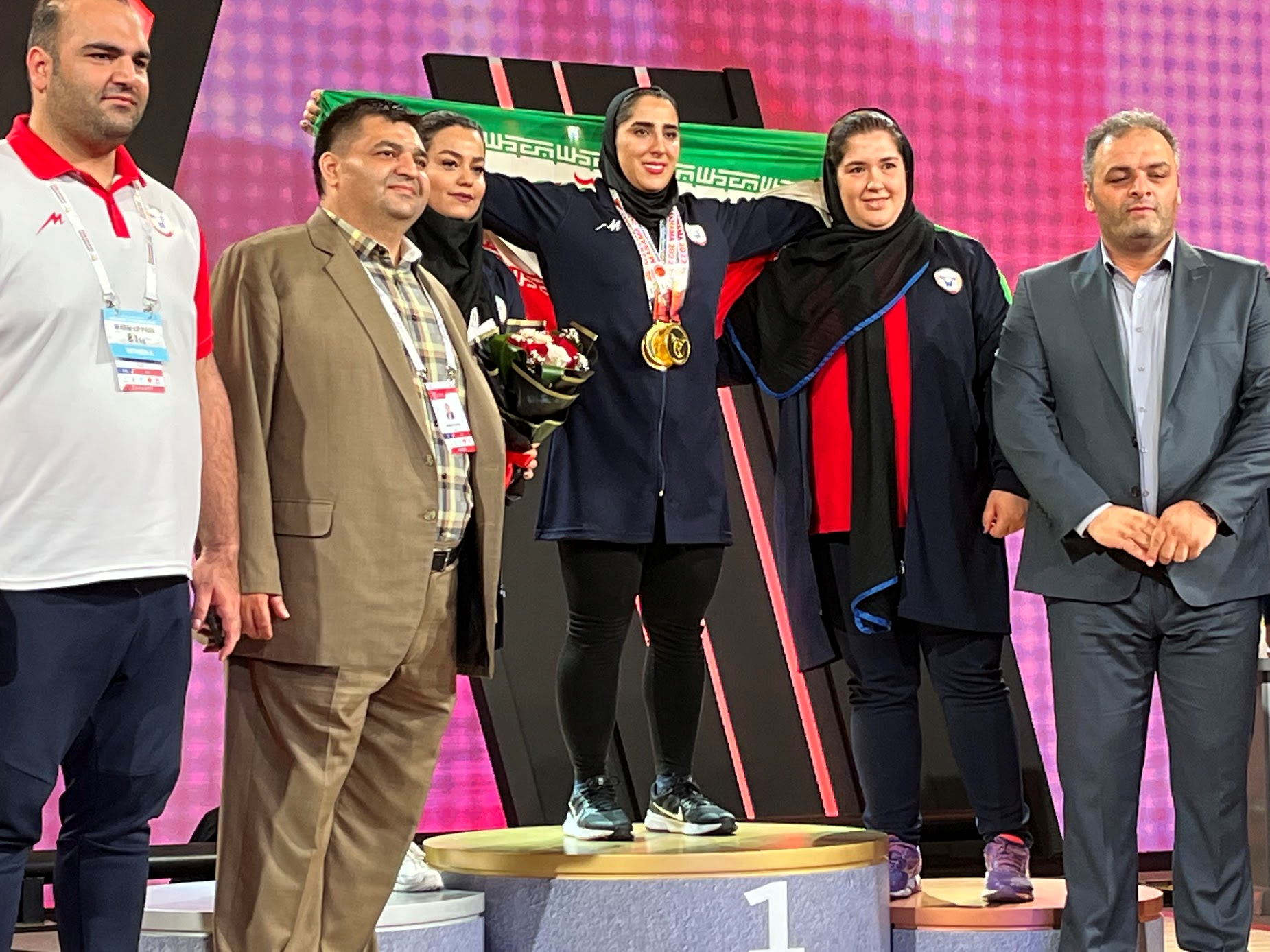 Seyyedeh Elham Hosseini celebrates on the podium at the Asian Championships, alongside, from left, Behdad Salimi, Hossein Rezazadeh and Sajjad Anoushirivani ©ITG