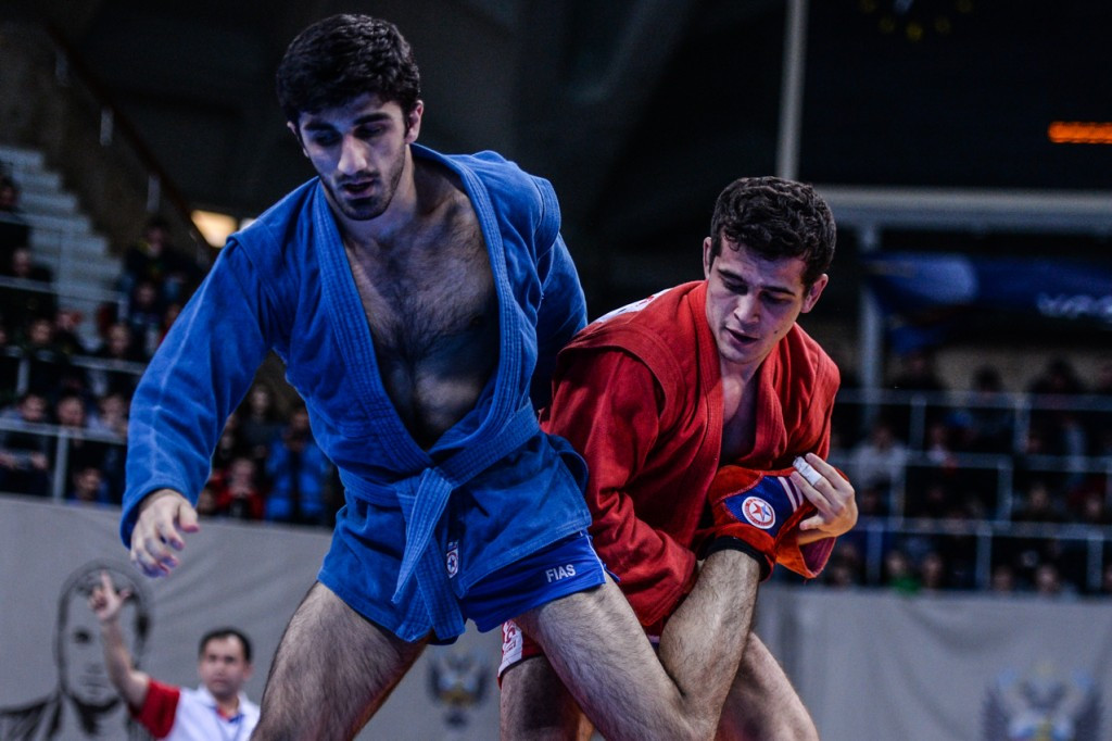 Uzbekistan's Sarbon Ernazarov (red) was the other, defeating Georgiy Shemazashvili in the men's 68kg showdown ©FIAS