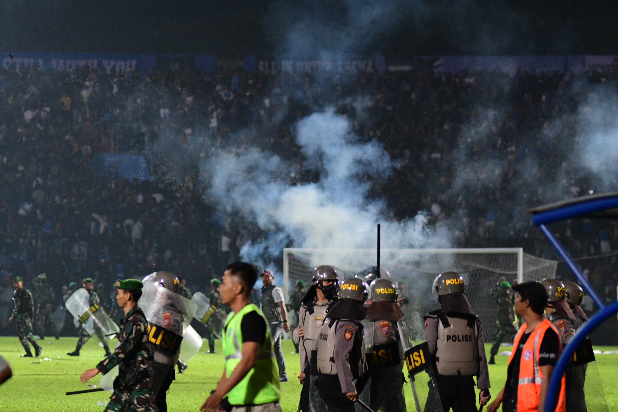 Supporters were crushed attempting to flee tear gas fired by police at the Kanjuruhan Stadium ©Getty Images