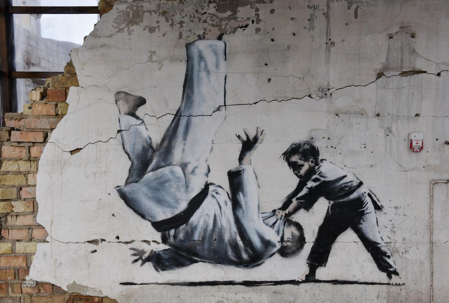 The Banksy graffiti depicting Vladimir Putin being flipped in a judo match appeared last year  on a wall in Borodyanka, near the capital Kyiv ©Getty Images