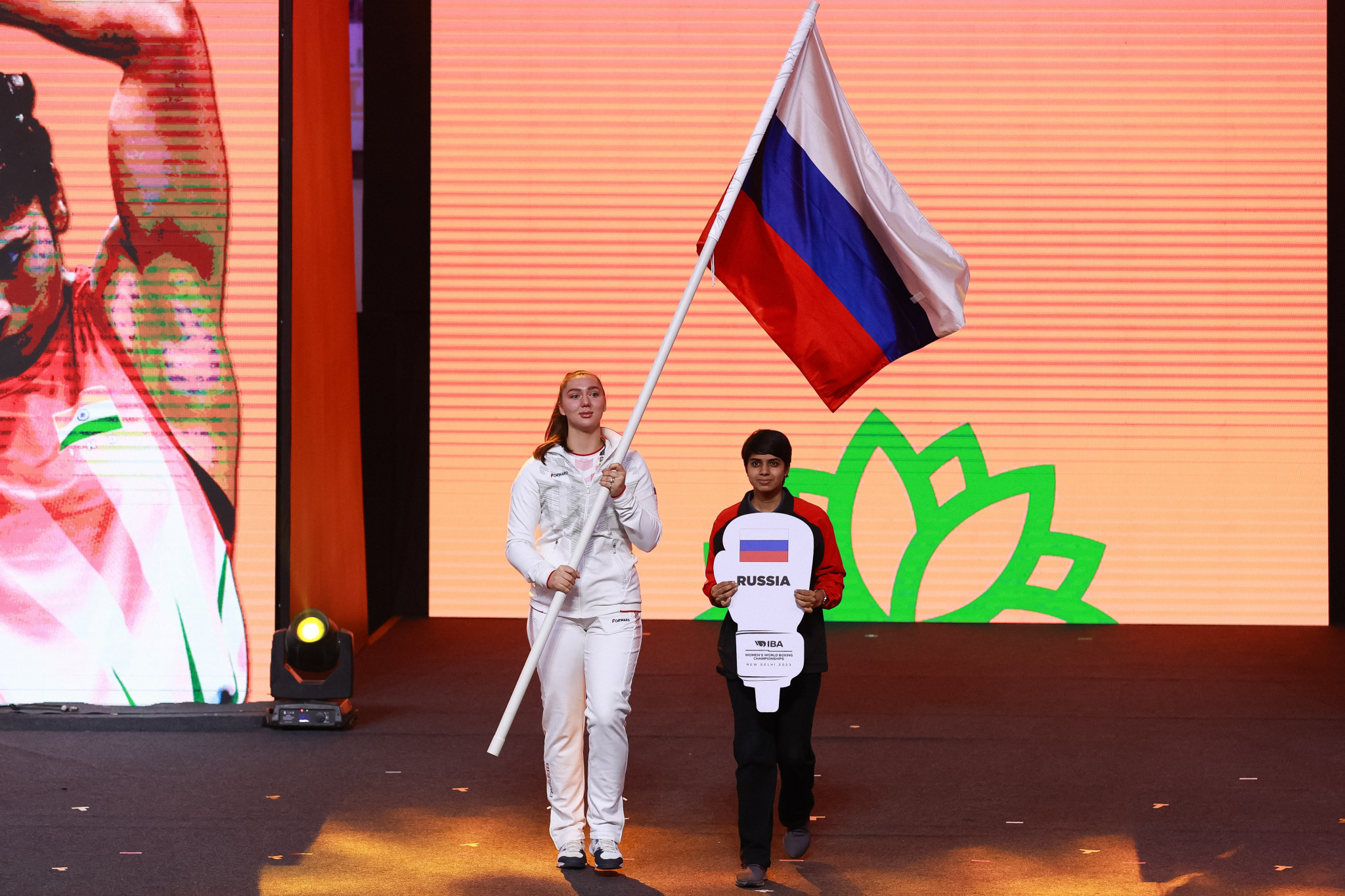Diana Pyatak, making her debut at the Women’s World Championships, was given the responsibility of carrying the Russian flag which she waved in front of the crowd ©IBA
