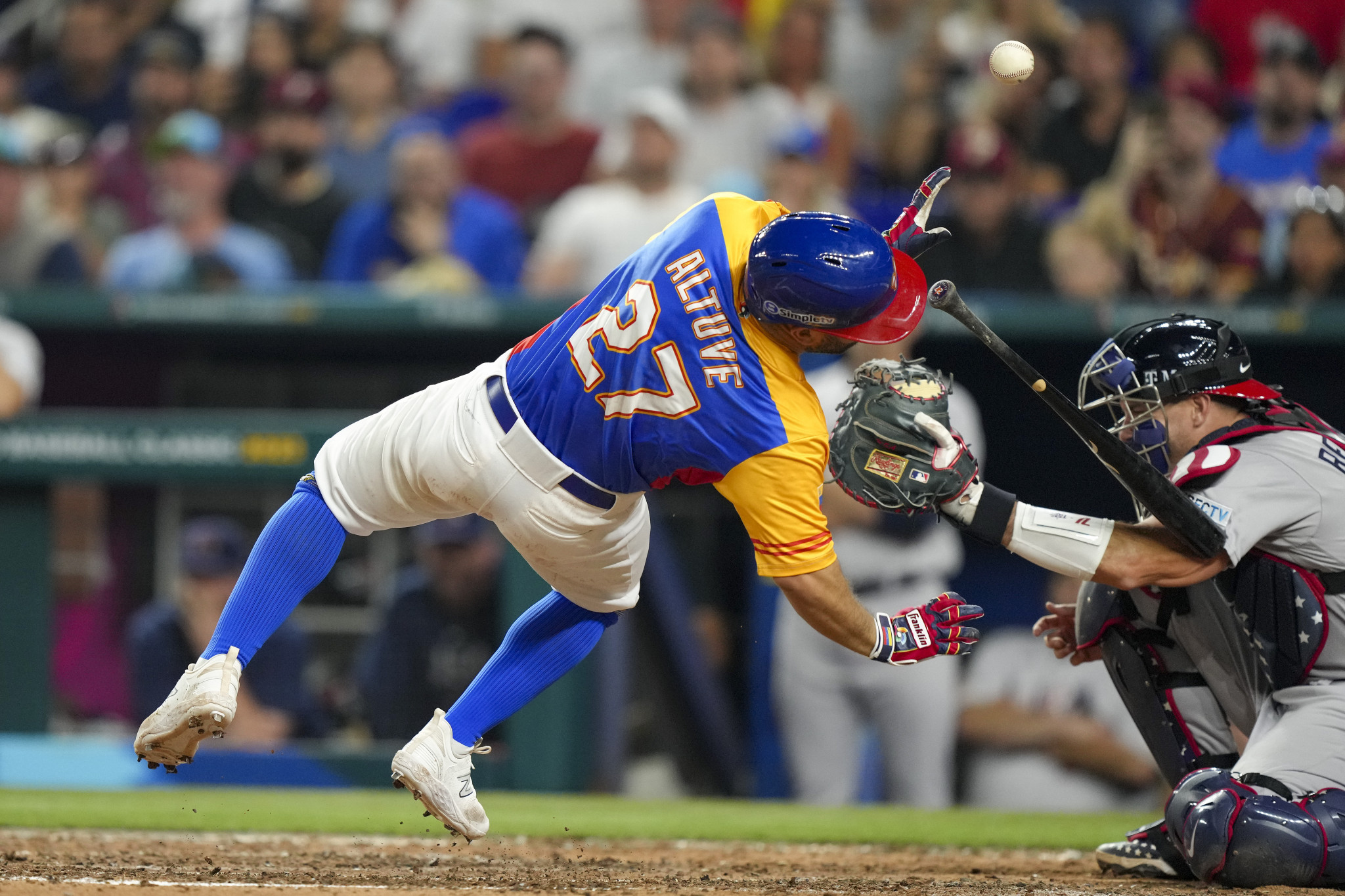 Venezuela's Jose Altuve was forced out of the match in the fifth inning after being hit on the hand by US pitcher Daniel Bard ©Getty Images