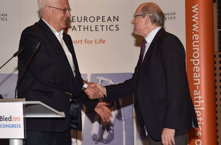 Svein Arne Hansen is congratulated on being elected European Athleics President by Hansjörg Wirz, who had held the post for 16 years