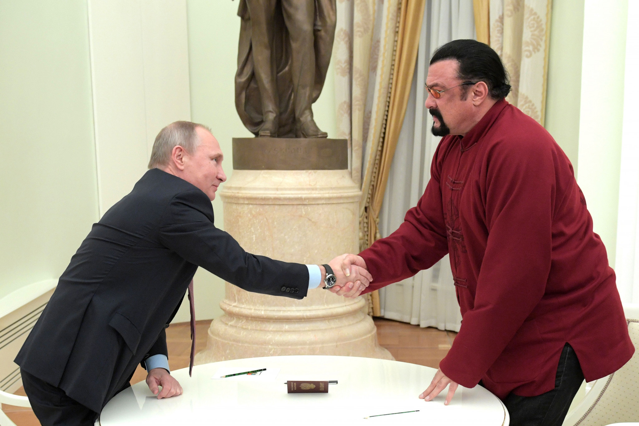 Steven Seagal, right, was awarded Russian citizenship in 2016 and recently granted the Order of Friendship by President Vladimir Putin, left ©Getty Images
