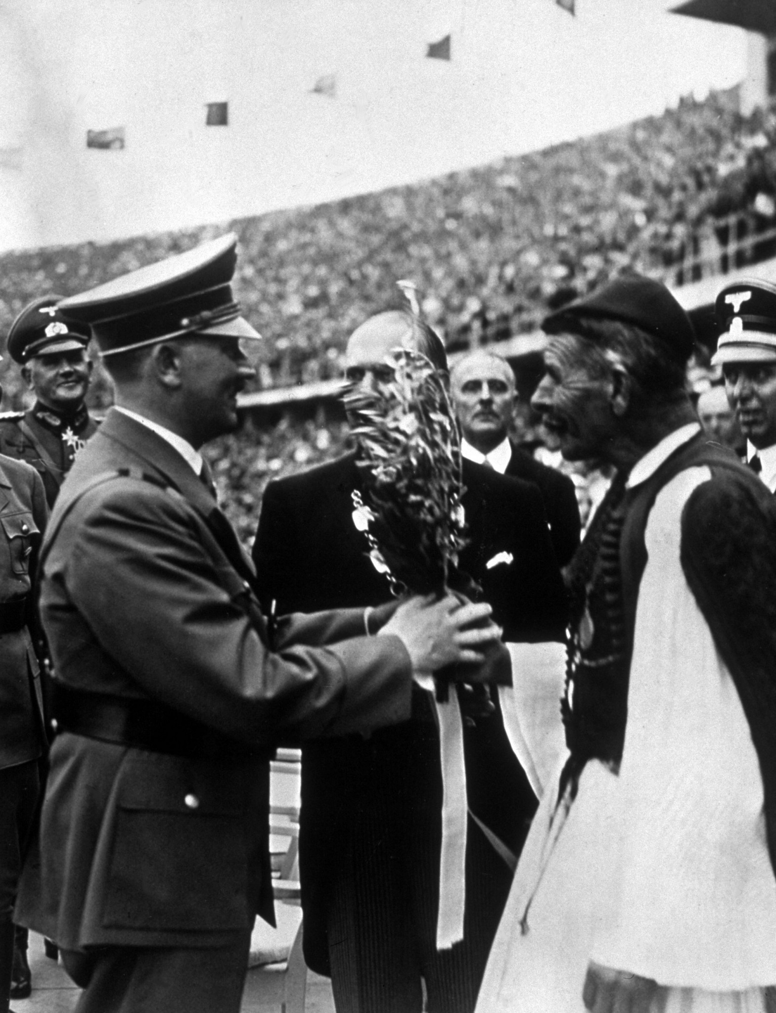 German dictator Adolf Hitler received an olive branch as a symbol of peace from 1896 marathon champion Spyridon Louis ©Getty Images