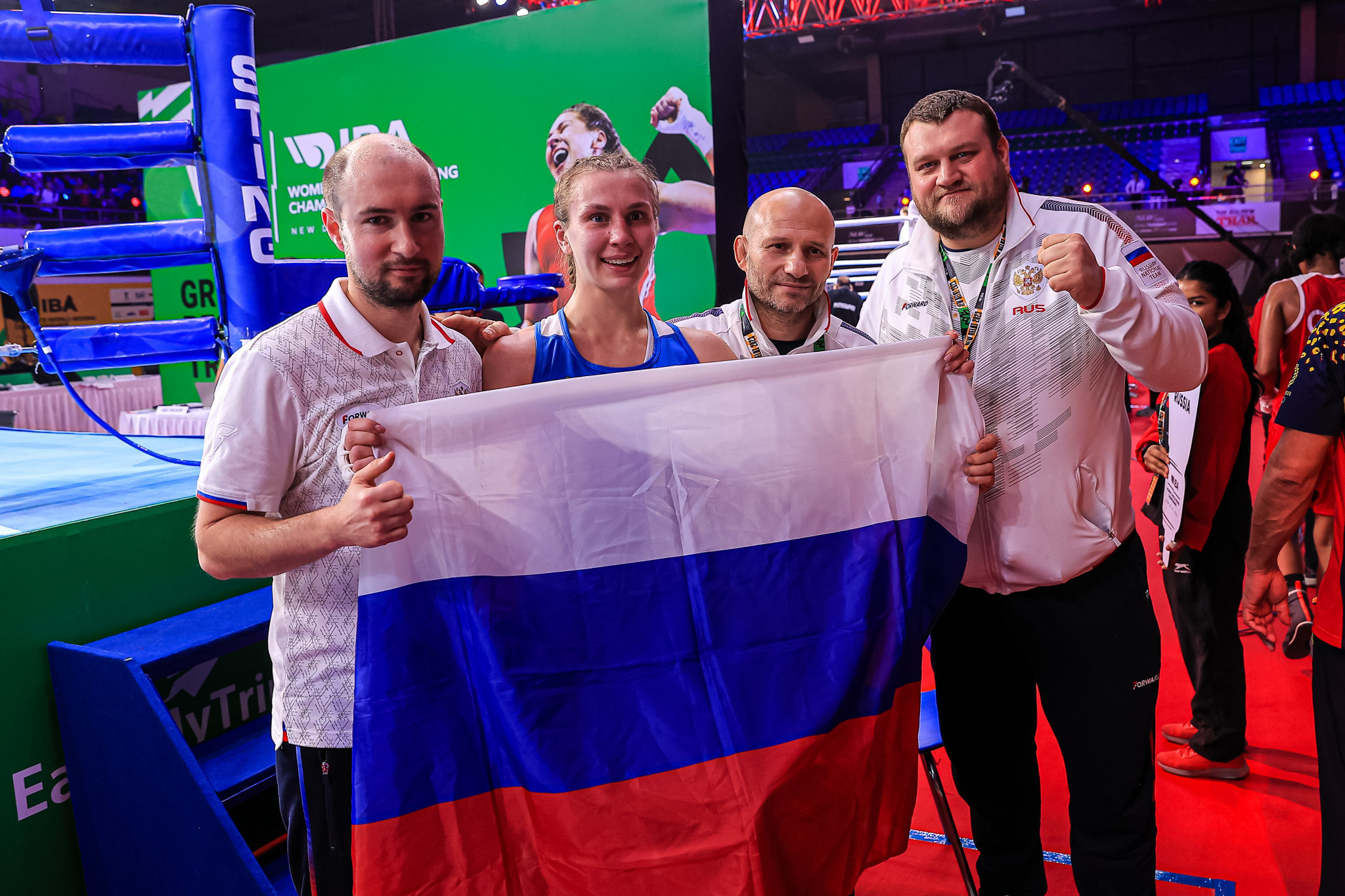 Russian coaches celebrate with Nataliya Sychugova after her light welterweight semi-final success ©IBA