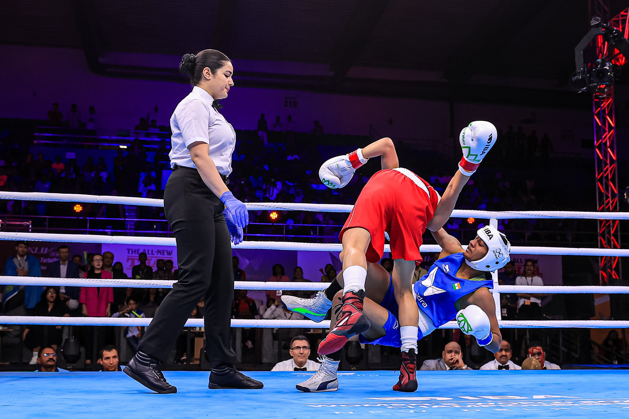 Kazakhstan's Alua Balkibekova pushes Nitu to the ground in their scrappy minimumweight semi-final clash ©IBA