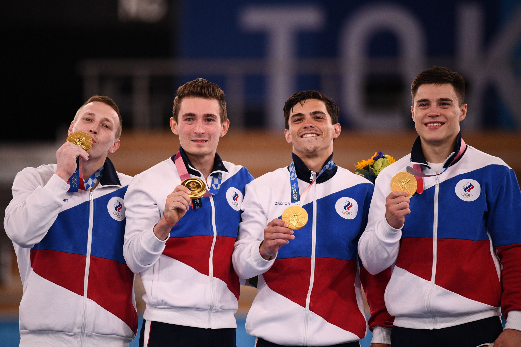 Artur Dalaloyan, second right, won Olympic gold in the gymnastics team event at Tokyo 2020 ©Getty Images
