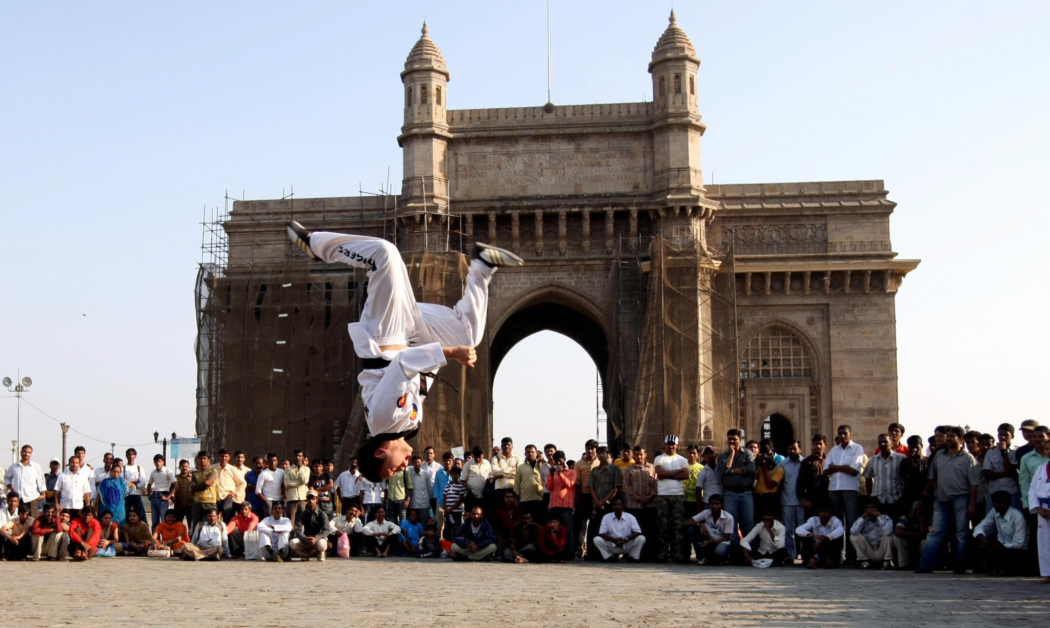 A taekwondo athlete performs by the Gateway of India in Mumbai ©Getty Images