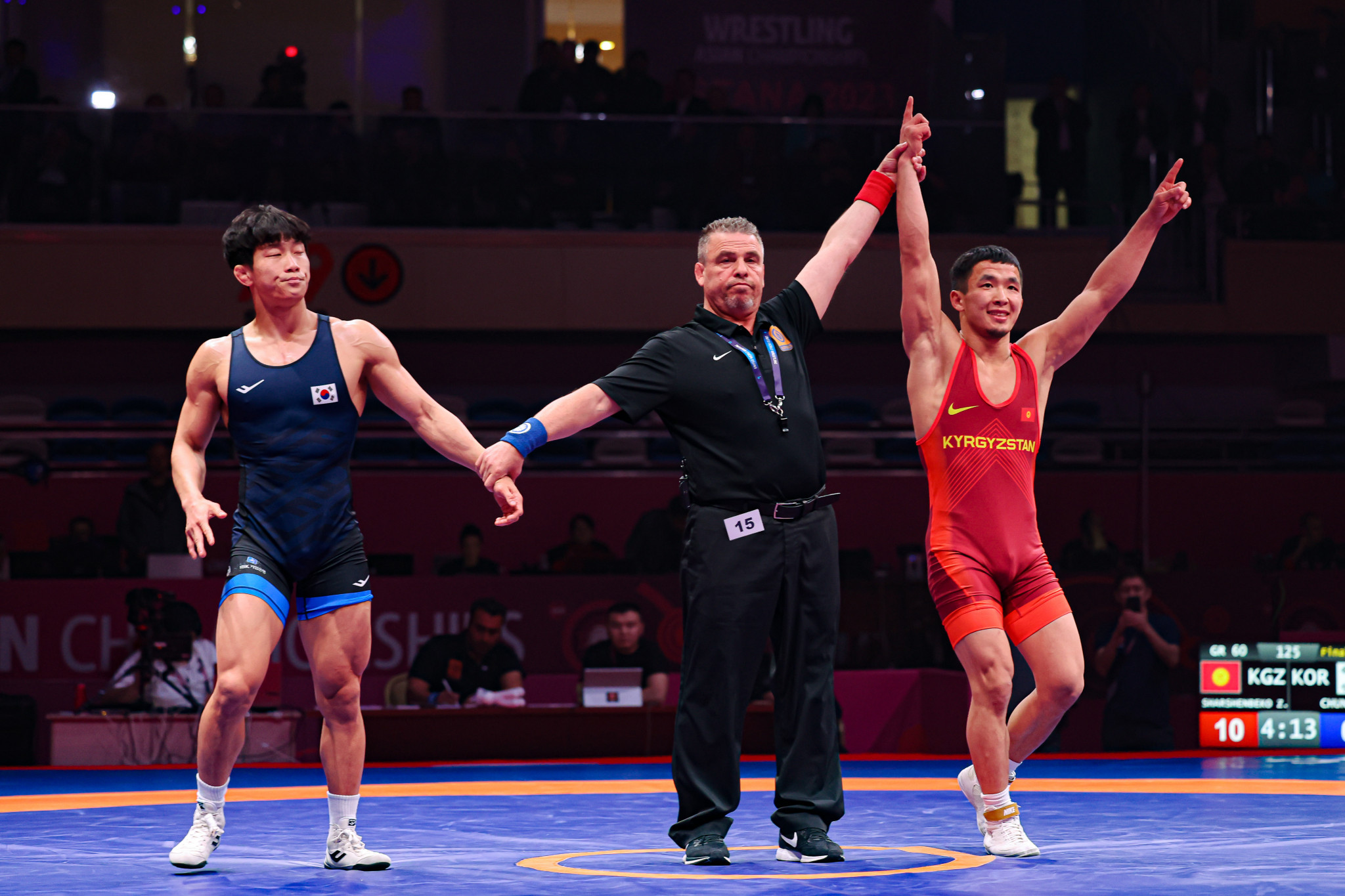 Kyrgyzstan's Zholaman Sharshenbekov, right, eased to a 10-0 win by technical fall in the Greco-Roman 60kg final against South Korea's Chung Han-jae, left, at the Asian Championships in Astana ©UWW