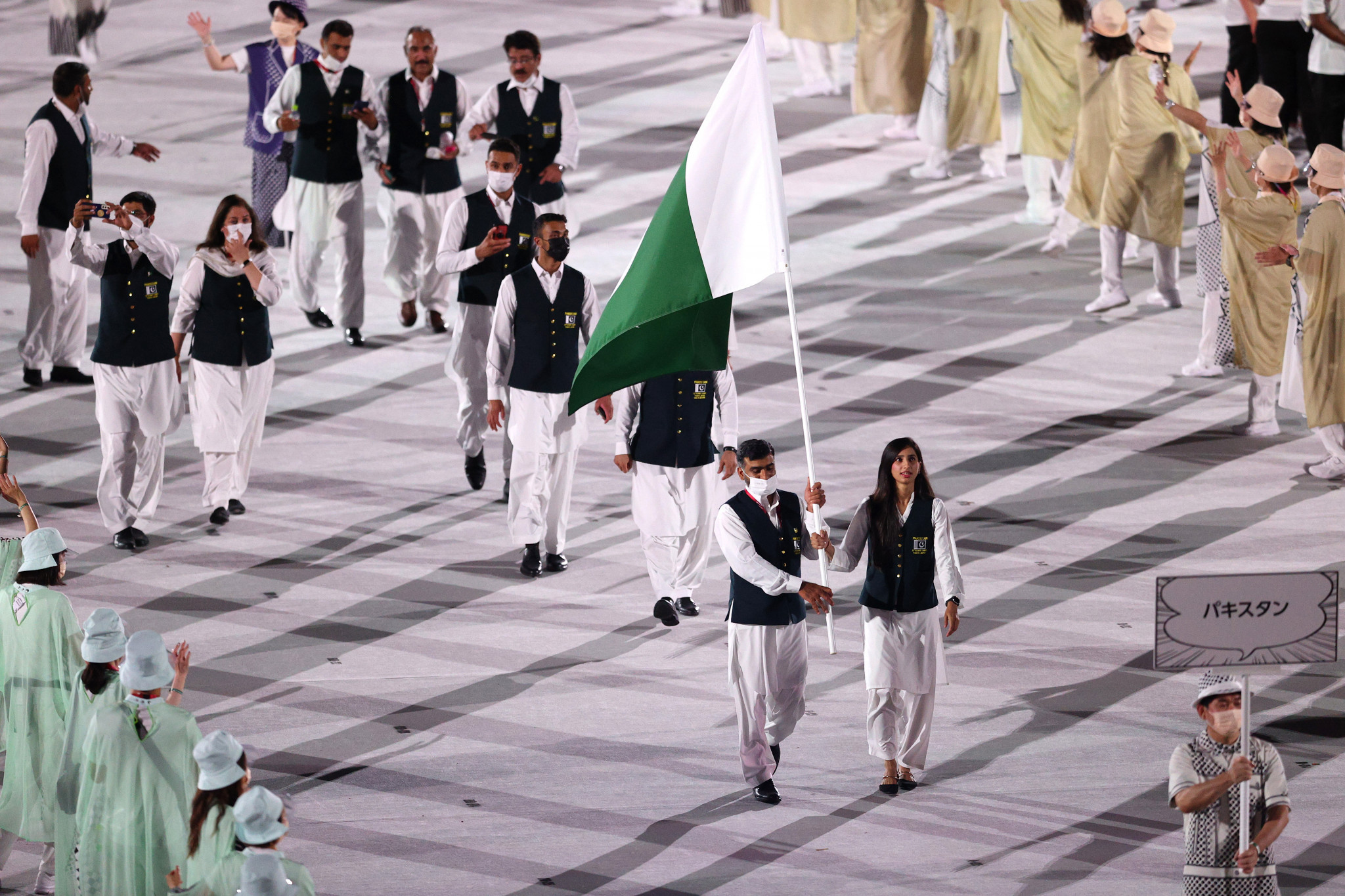 Akhtar, left, carried Pakistan's flag at the Tokyo 2020 Opening Ceremony alongside badminton player Mahoor Shahzad ©Getty Images