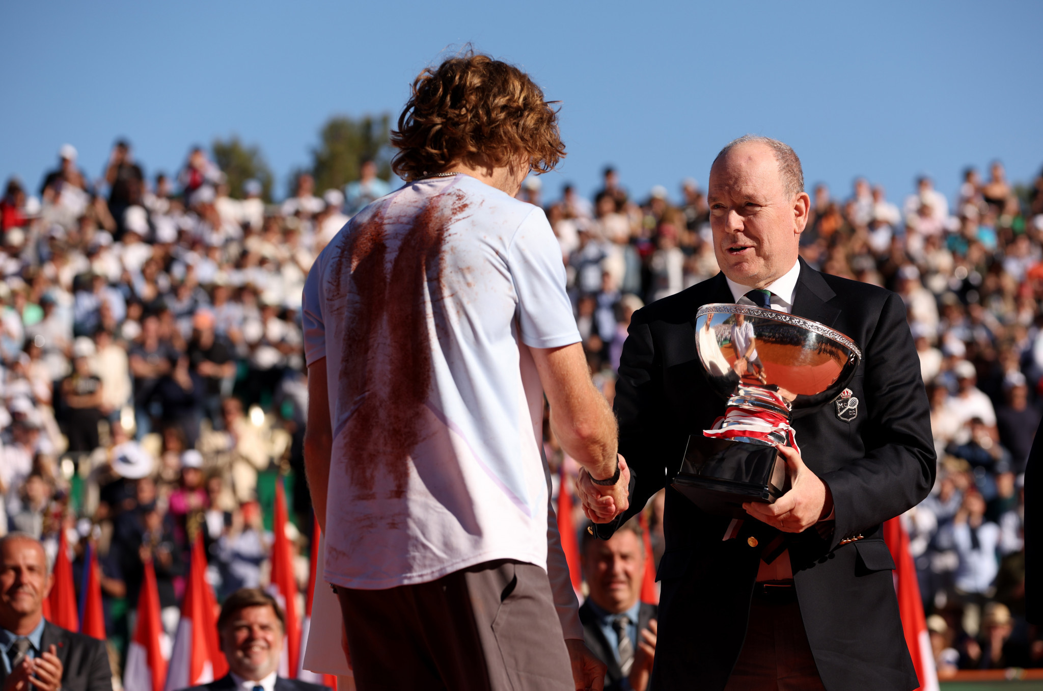 Andrey Rublev receives the trophy from Prince Albert II ©Getty Images