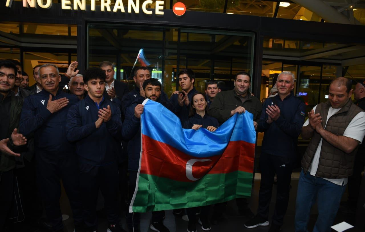 Azerbaijan's weightlifting team arrive back at Baku Airport after withdrawing from the European Championships in Yerevan following a flag-burning incident ©Trend News Agency