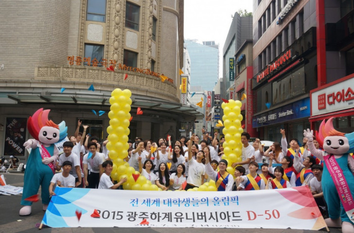 Gwangju 2015 supporters promoting the Summer Universiade in Seoul’s shopping mecca, Myeongdong