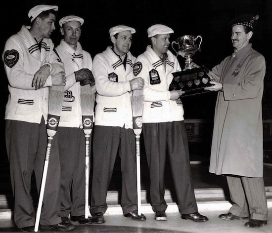 Matt Baldwin, second from right, receives the Brier Tankard after his third victory in 1958 ©Macdonald Tobacco