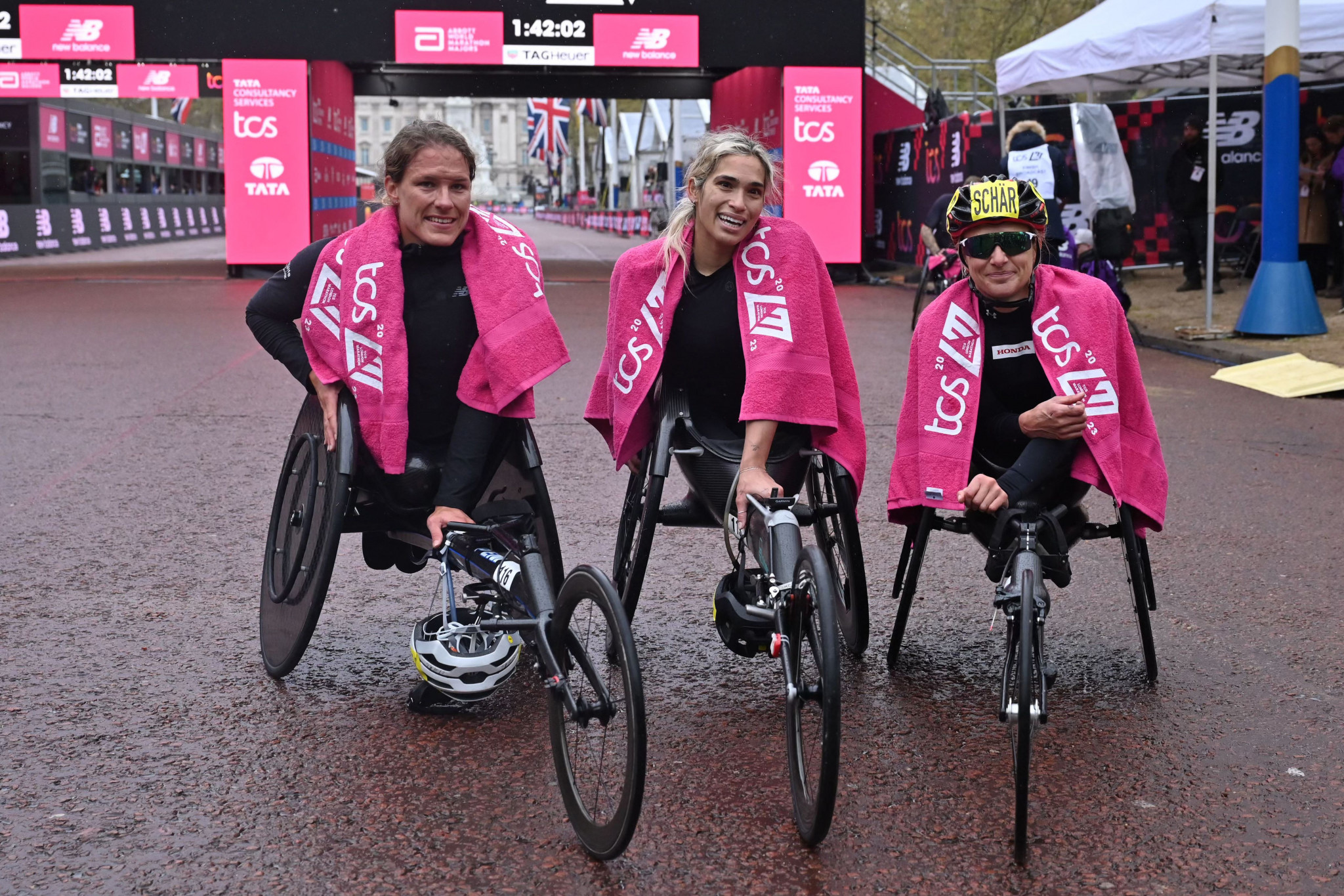 The top three in the women's wheelchair race - from left Catherine Debrunner, who was third, winner Madison de Rozario and Manuela Schar, who was second ©Getty Images