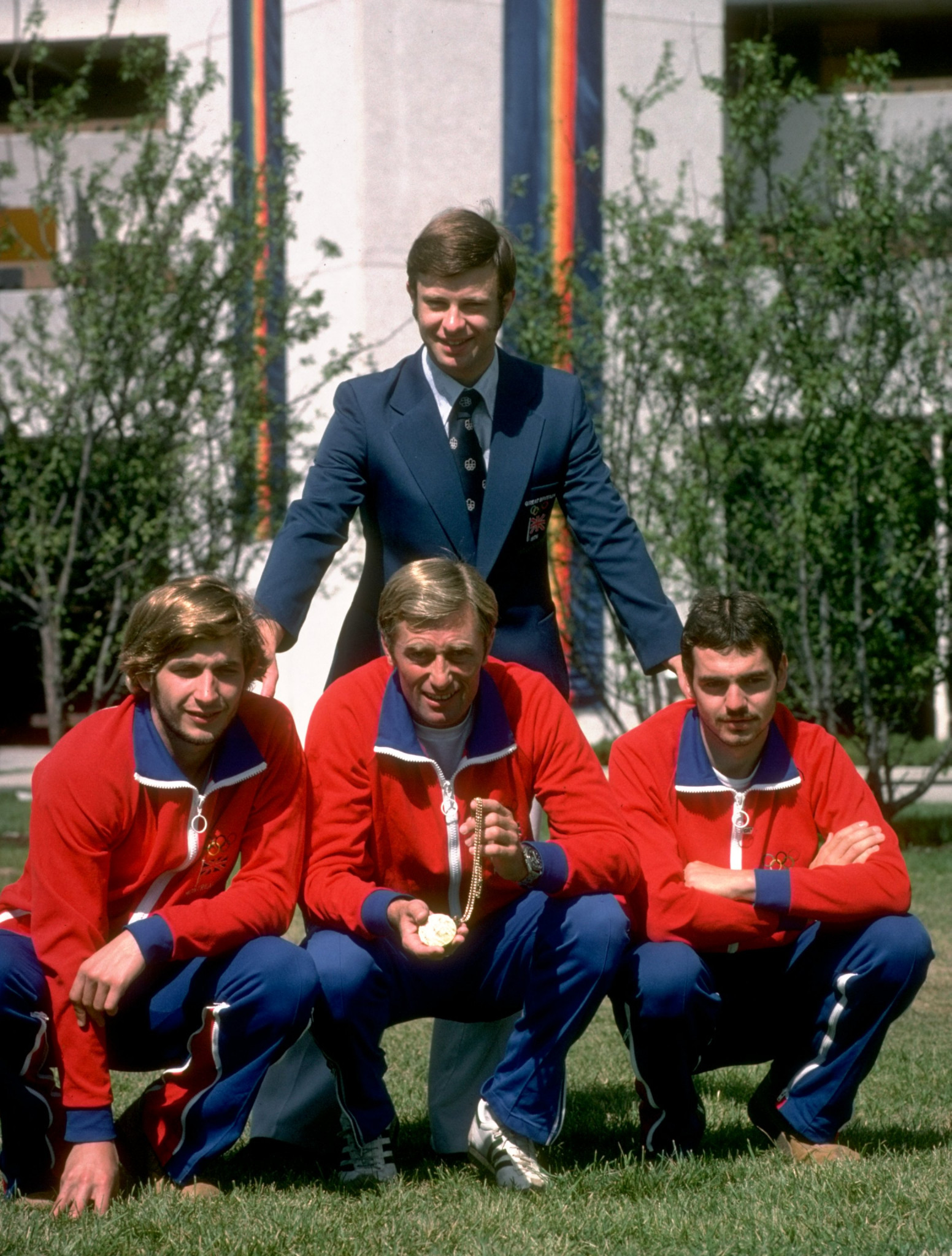 Jim Fox is flanked by Adrian Parker and Danny Nightingale after their team gold at the 1976 Montreal Olympics for which they received a single gold medal ©Getty Images