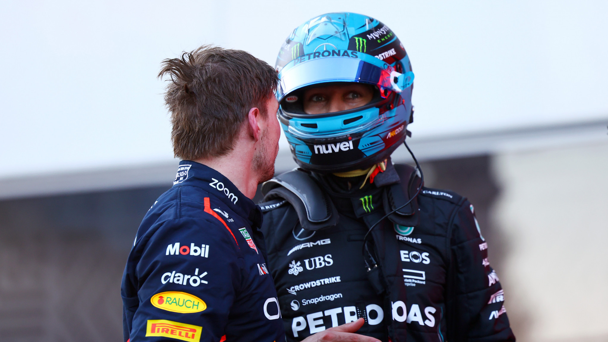 Max Verstappen, left, exchanged angry words with George Russell after the pair had a minor collision on the first lap ©Getty Images