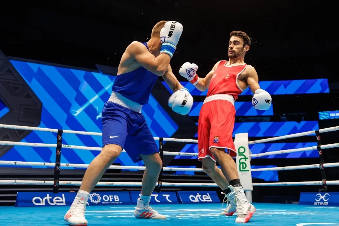 European lightweight silver medallist José Quiles of Spain, right, benefitted against Krenar Zeneli of Albania when referee stopped contest during round three ©IBA