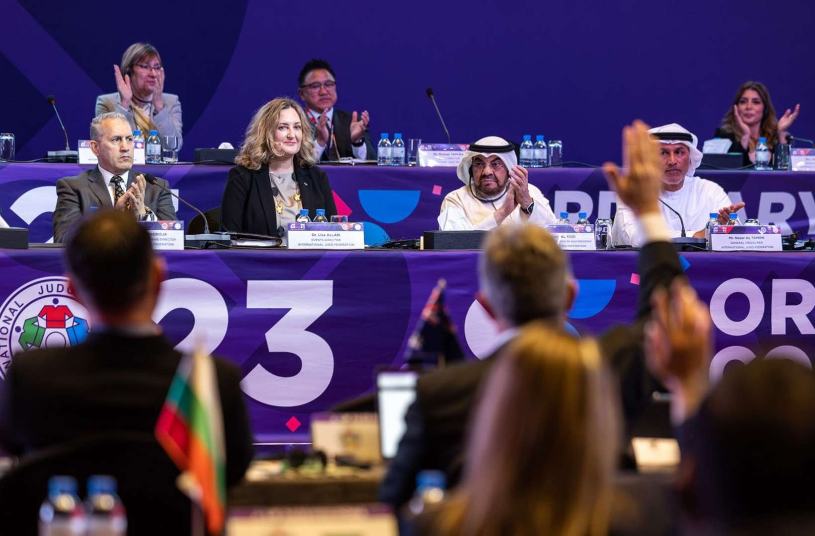 Britain's Lisa Allan, second left at front, was elected unanimously as IJF general secretary at the Congress in Doha ©IJF