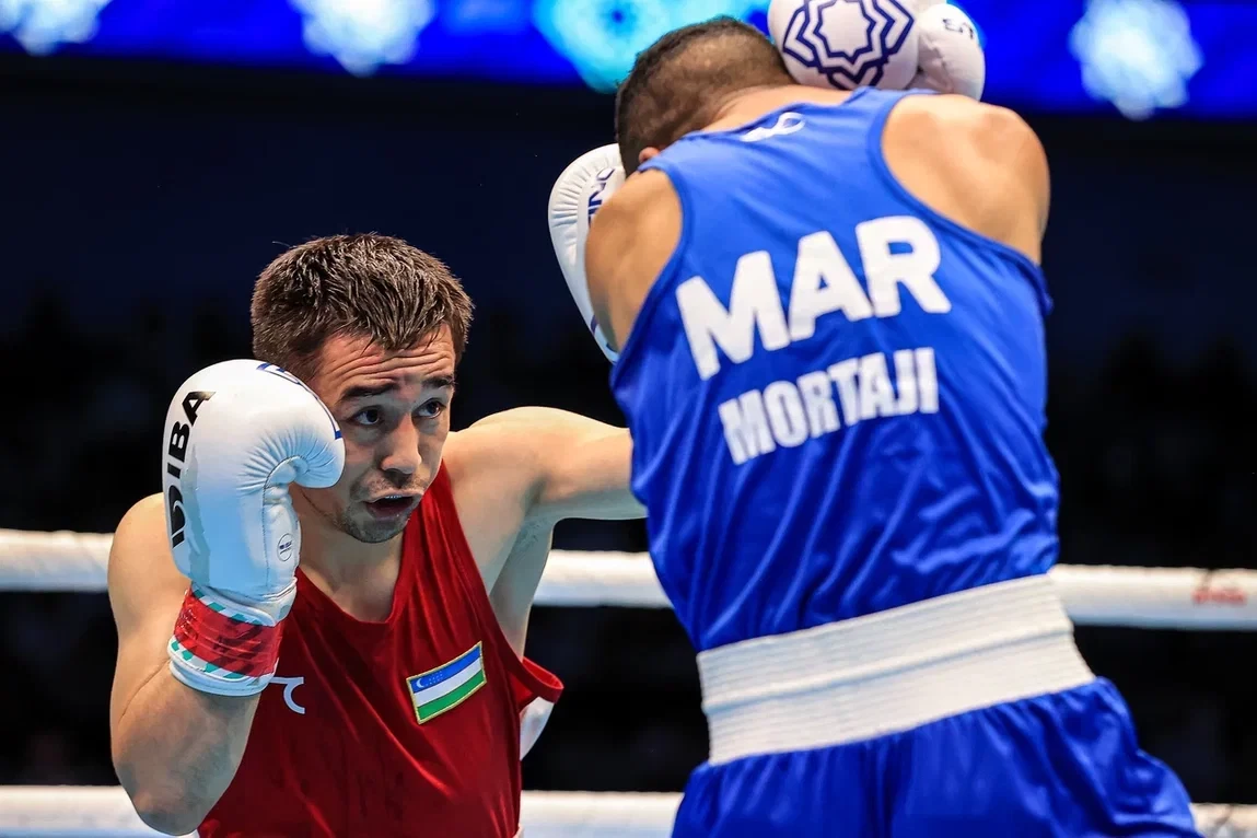 Rio 2016 gold medallist Hasanboy Dusmatov of Uzbekistan, left, defeated Said Mortaji of Morocco ©IBA
