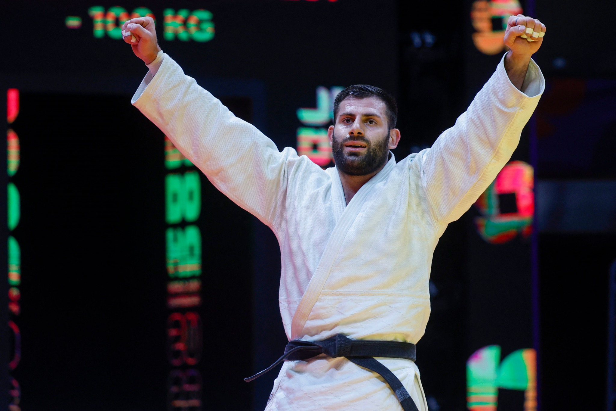 Russian judoka Arman Adamian celebrates after winning men's under-100kg gold in Doha ©Getty Images