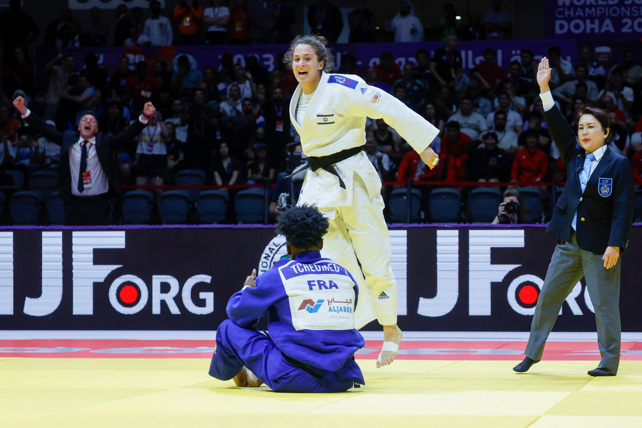 Inbar Lanir and her coach celebrate after producing an impressive display to win the women's under-78kg final ©Getty Images