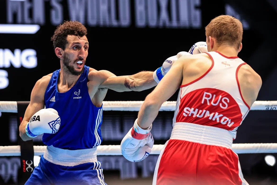 Two-time world champion and second seed Sofiane Oumiha of France, left, won against third seed Vsevolod Shumkov of Russia in the lightweight semi-final ©IBA