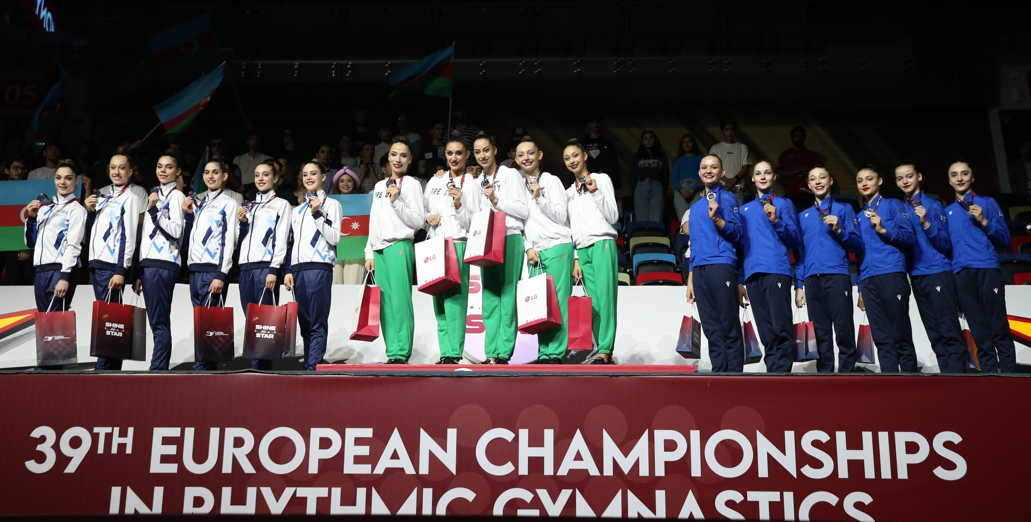 Bulgaria, centre, was unstoppable in the groups all-around event as well ©AGF