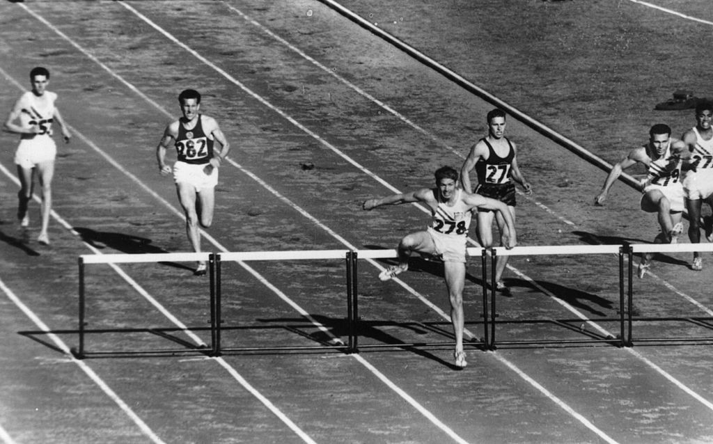 Eddie Southern, pictured right taking 1956 Olympic 400m hurdles silver behind fellow American Glenn Davis, has died aged 85 ©Getty Images