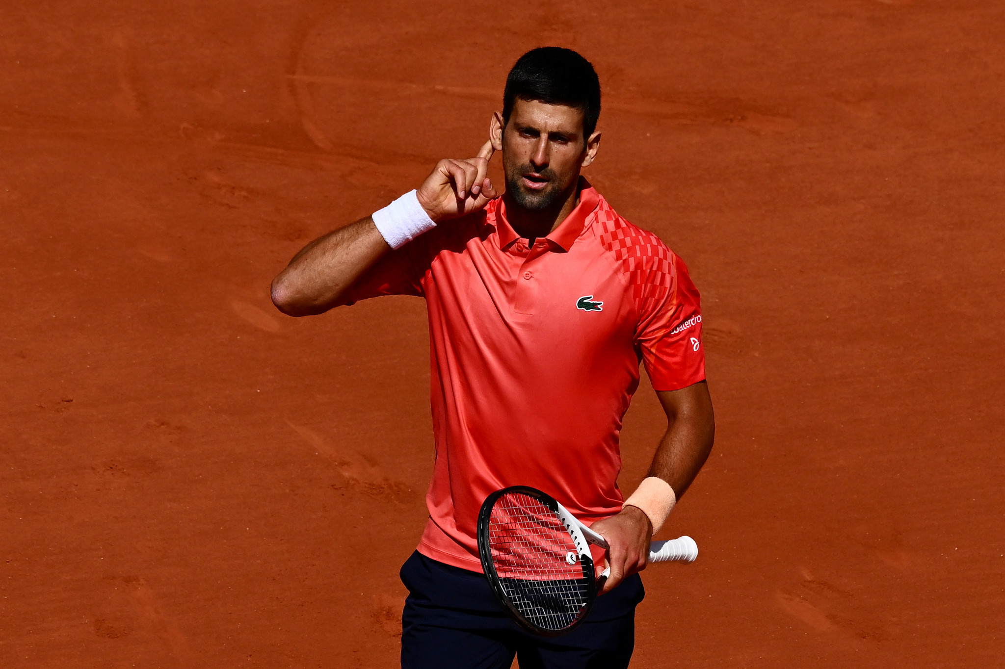 Djokovic begins French Open with dominant display as he seeks record title