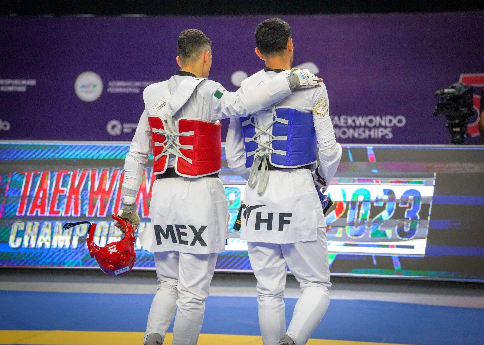 Refugee Team Athlete Yehya Al Ghotani, right, became the first player to compete at the World Championships from the THF's flagship Azraq Camp project ©World Taekwondo