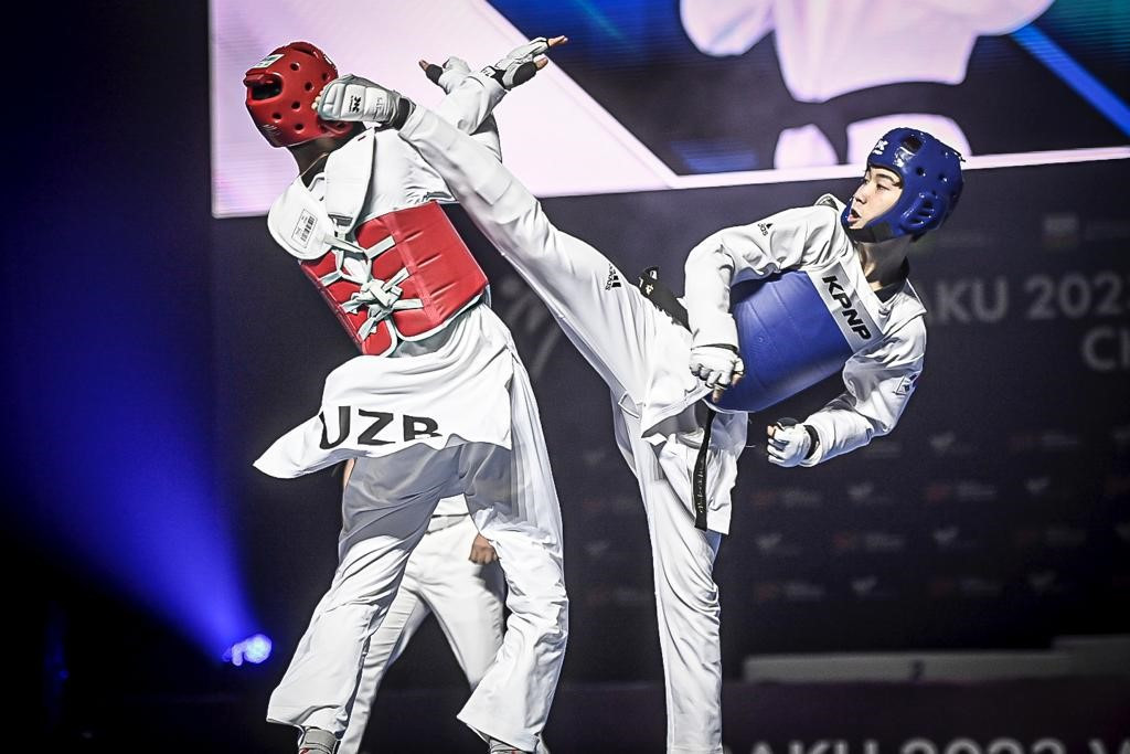 The men's under-54kg podium featured four first-time World Championships medallists, including Park, right, and Otajonov, left ©World Taekwondo