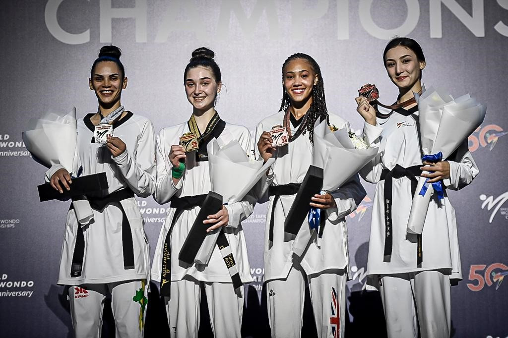 Liliia Khuzina, second left, became the first Russian competing as a neutral to top the podium at the World Taekwondo Championships ©World Taekwondo