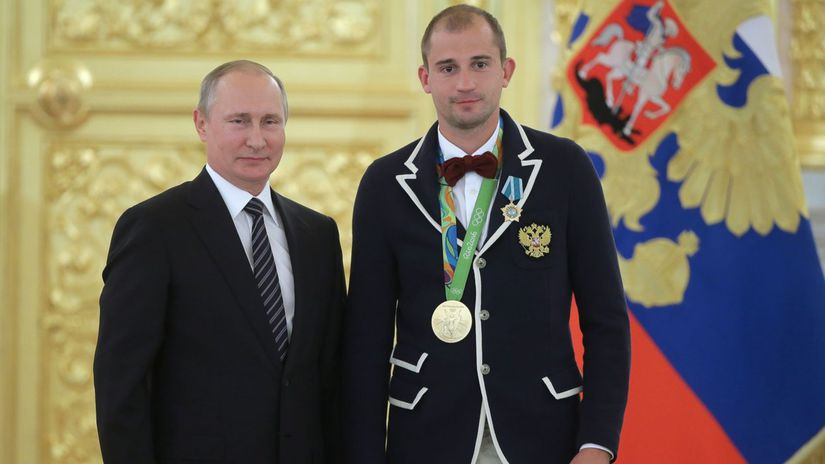 It had been claimed last year that Alexander Lesun, right, had quit Russian modern pentathlon in protest at the invasion by Vladimir Putin, left, of Ukraine ©The Kremlin