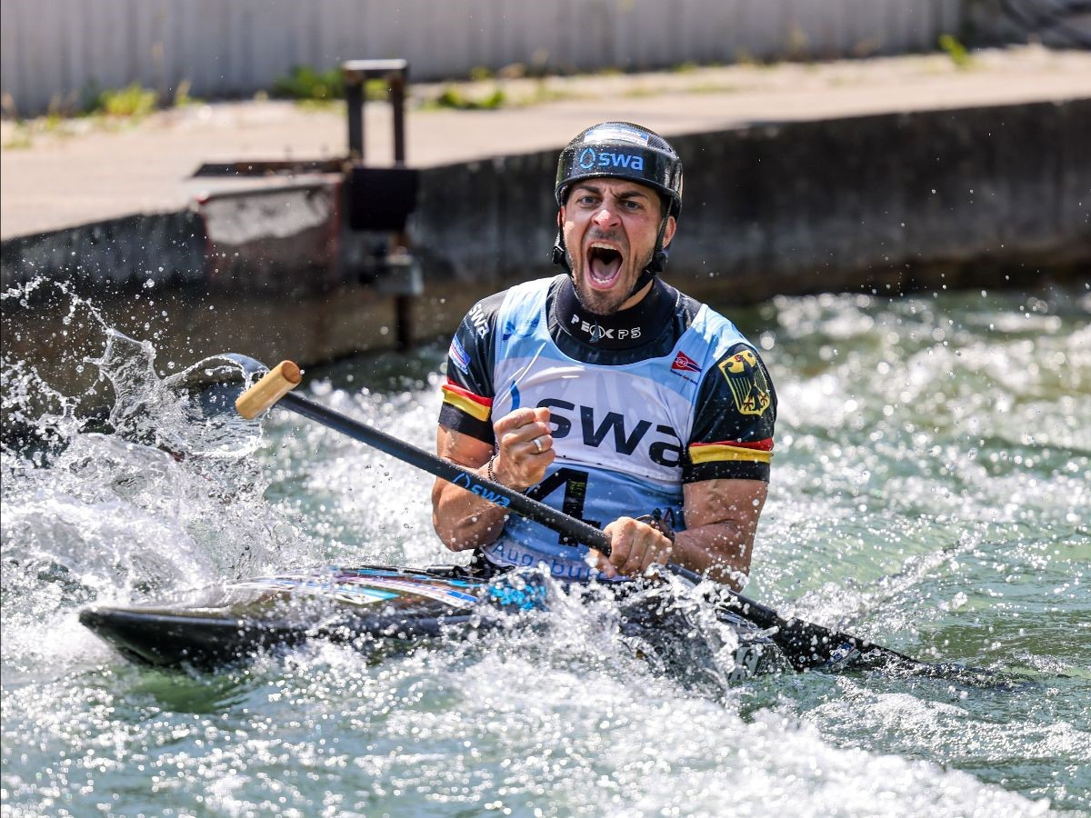 Sideris Tasiadis celebrates winning the men's canoe discipline in Augsburg, a year after winning gold on the same course at the World Championships ©ICF